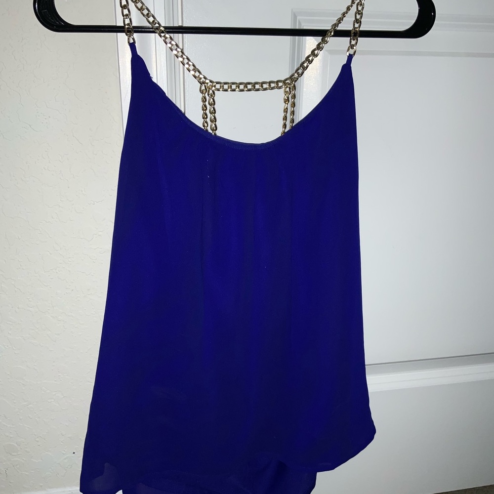 Gold chain blue tank top with open back